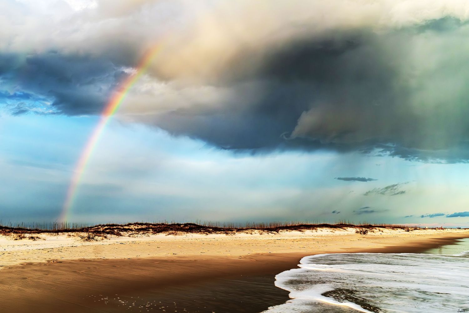 Rainbow and the storm on the beach, pensacola beach, florida