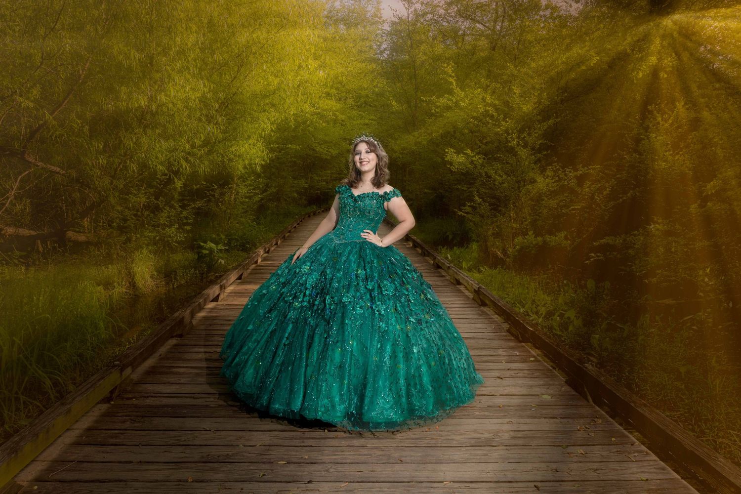 Emerald ball gown with sparkles captured in magical forest setting at sunset.
