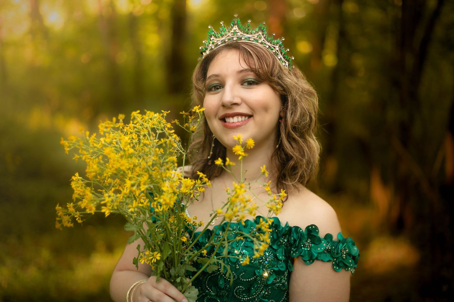 Magical forest scene with emerald gown and yellow wildflower bouquet.