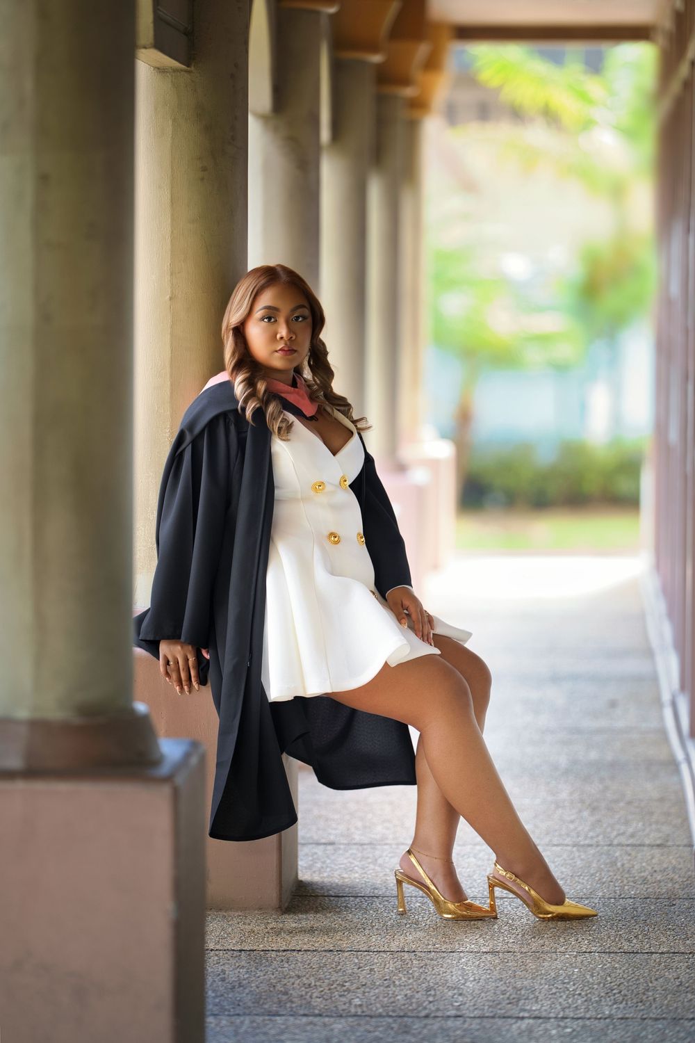 Fashion portrait series showing stylish footwear and clothing details against a backdrop of elegant columns.