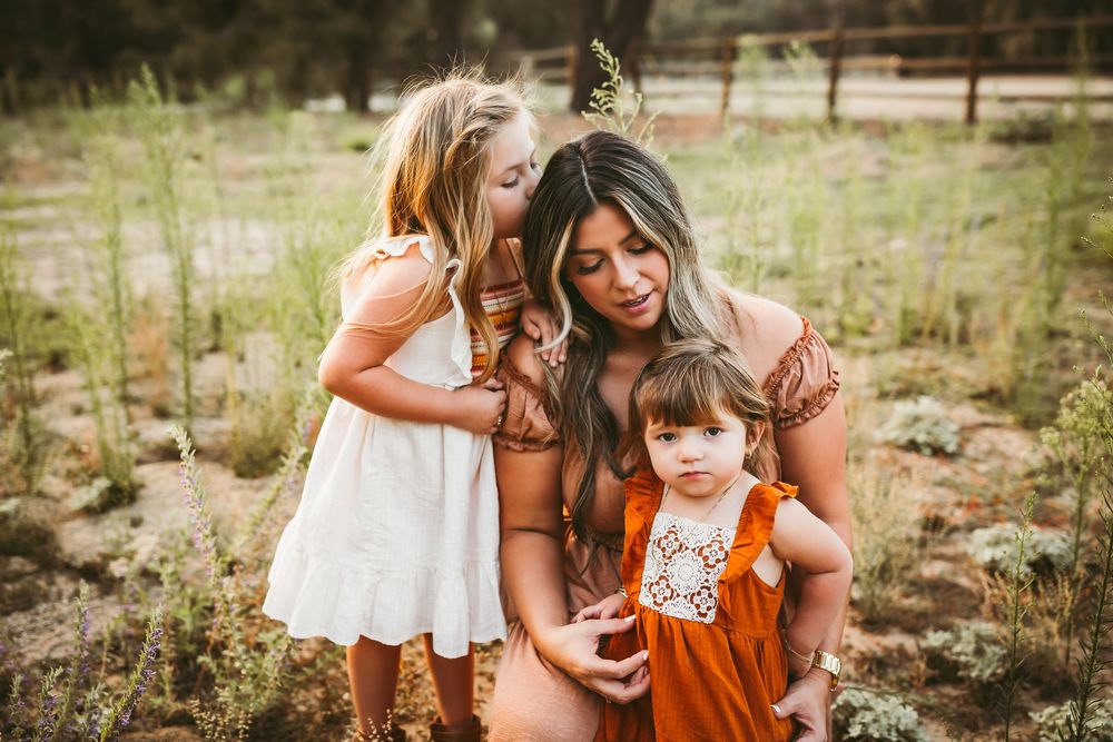 A collection of outdoor family photos showing tender moments in a sunlit field during golden hour.