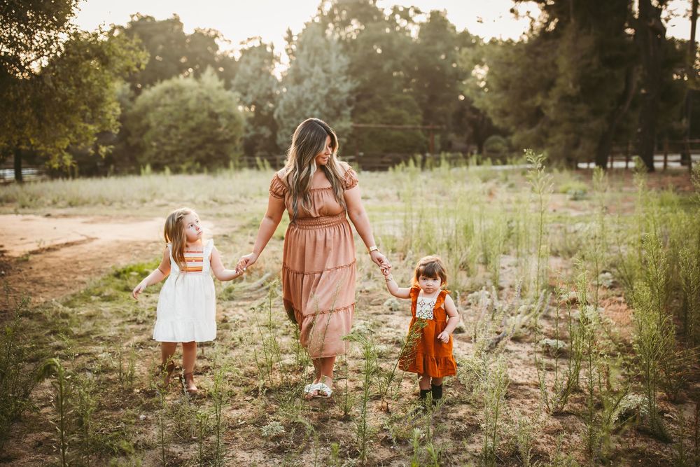 Series of lifestyle portraits captured in a rustic field setting with soft natural lighting and earthy tones.