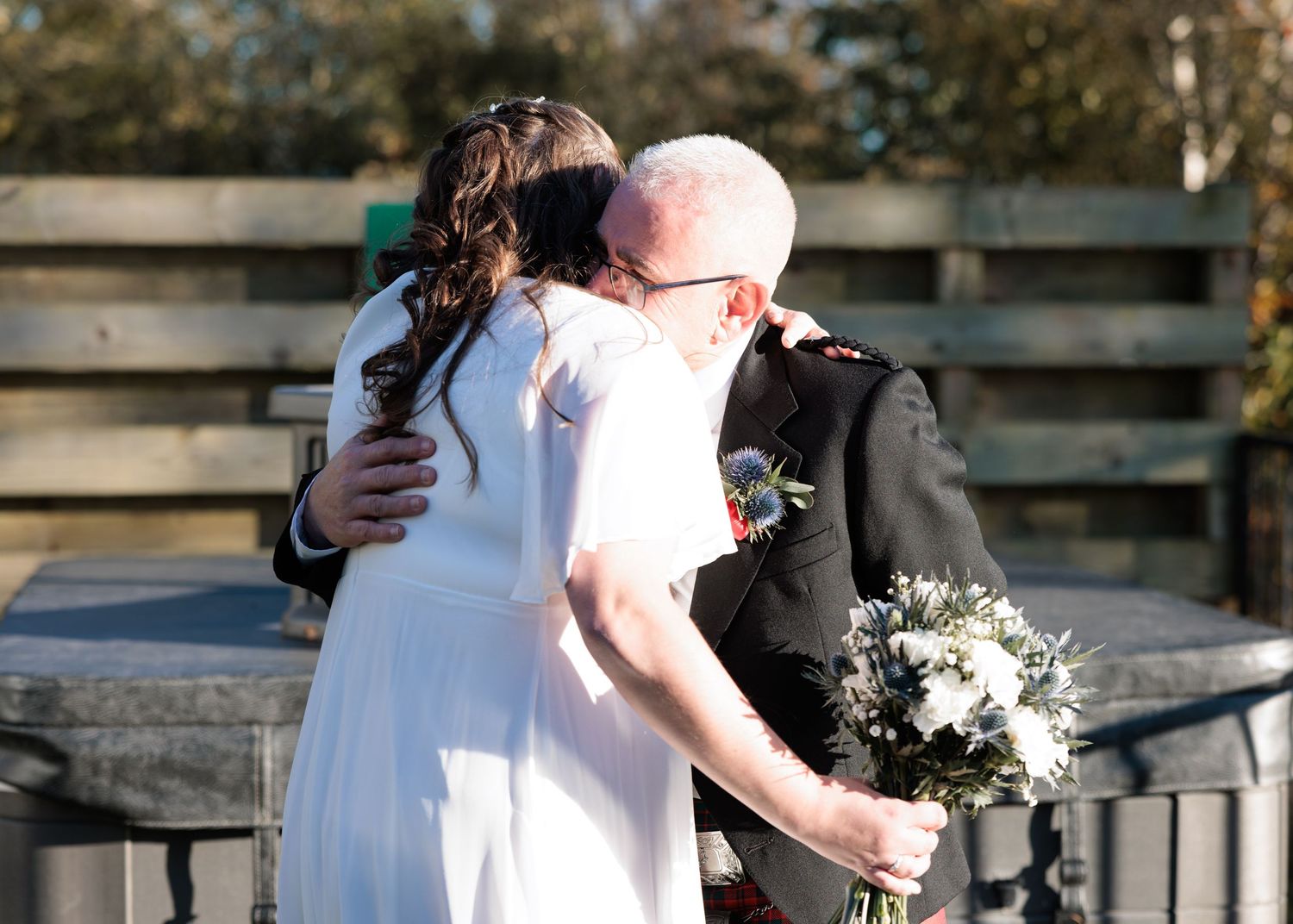 A series of romantic wedding photos showing couples embracing outdoors in natural lighting.