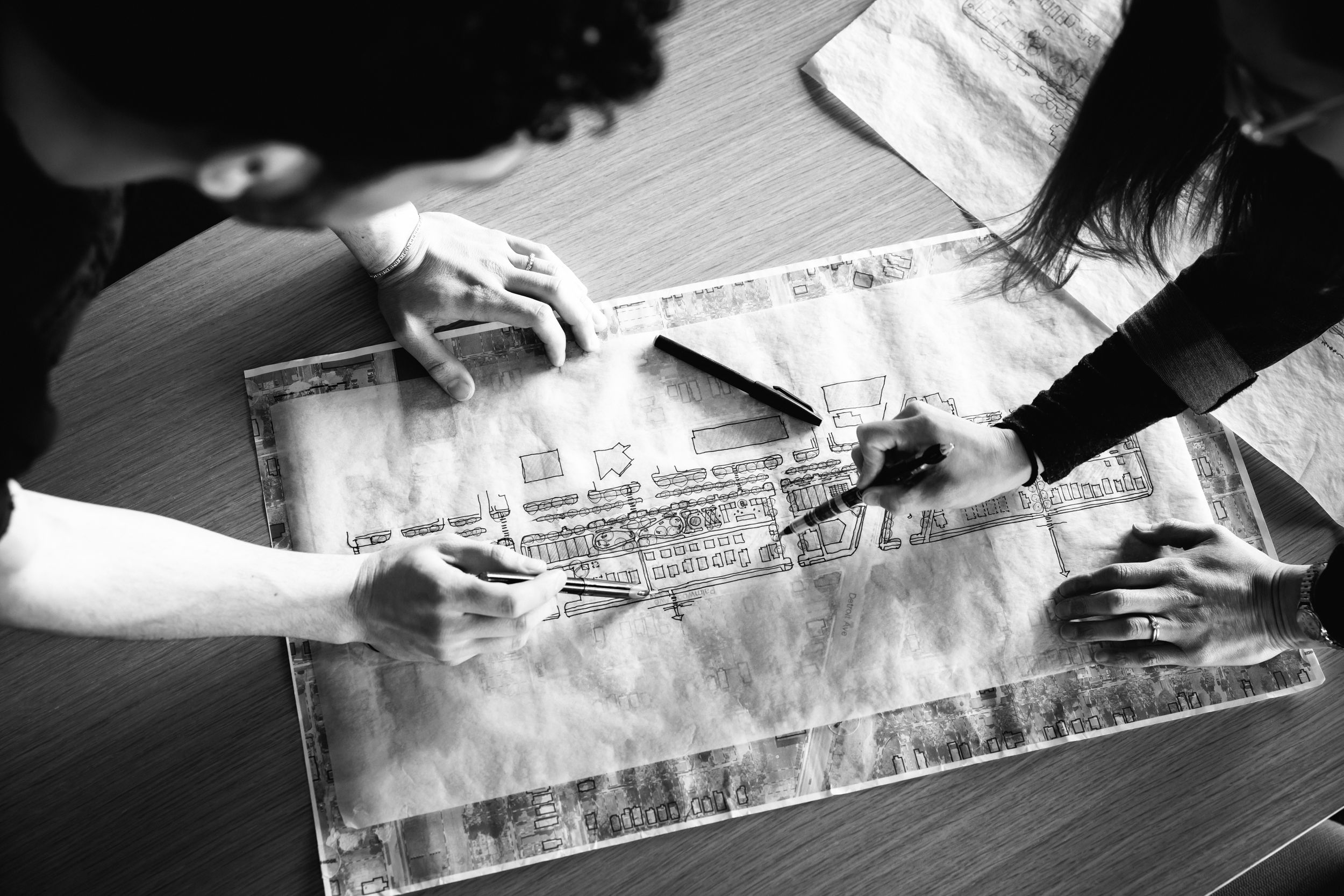 Close-up sequence showing hands measuring and marking wood with a ruler and pencil for precise woodworking.