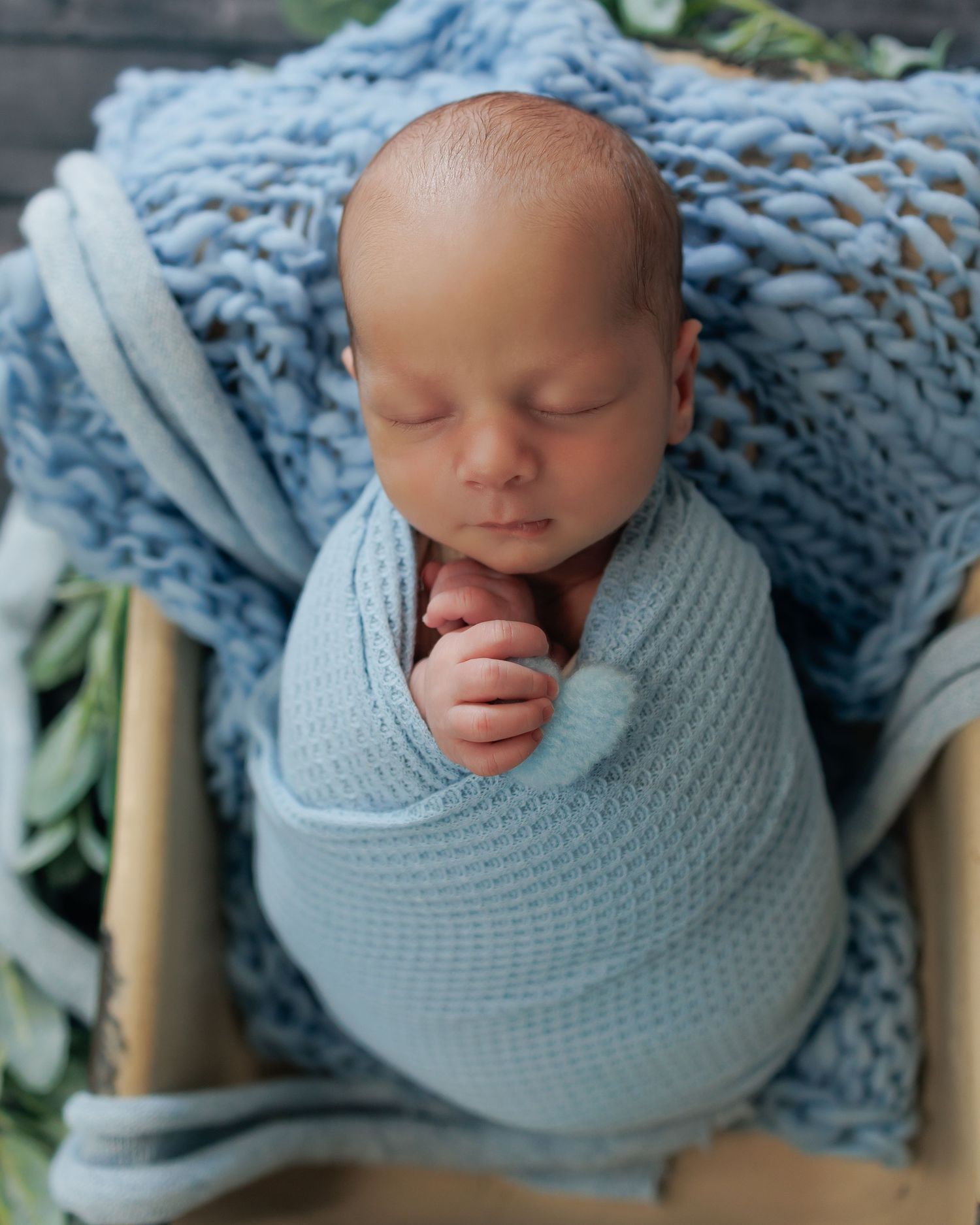 Sleeping newborn photographed individually during a twin newborn session in Attica MI