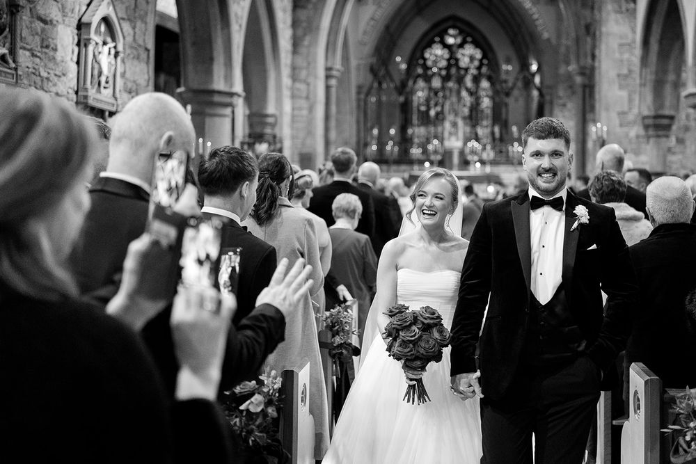 A series of black and white wedding photos showing a couple and guests celebrating at a traditional church ceremony.