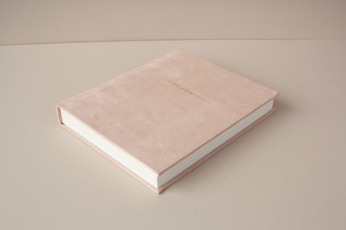 Luxury newborn photo album suede cover Nashville portrait studio Thompson’s Station