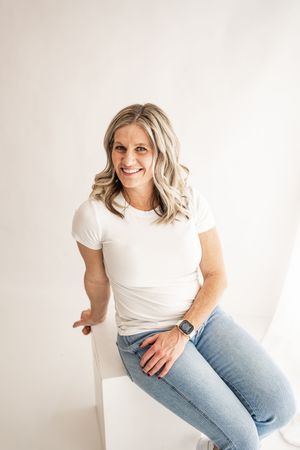 Person in casual white t-shirt and jeans sitting against white background in three different poses.