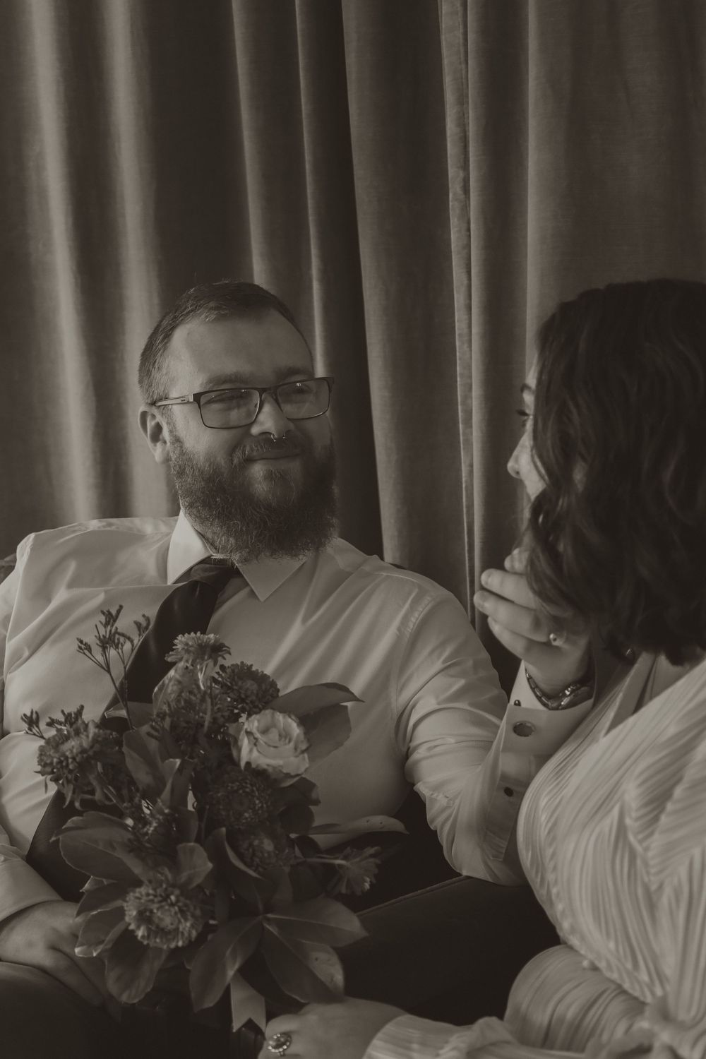 A series of black and white photos showing intimate moments during a wedding celebration.