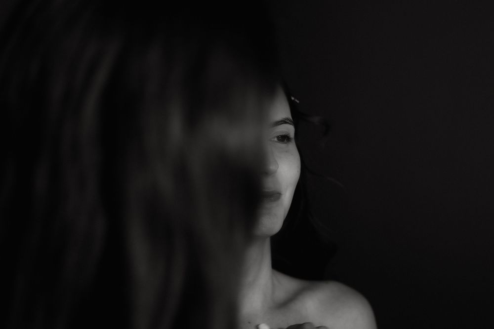 A dramatic black and white photo series showing silhouettes and profiles against dark backgrounds.