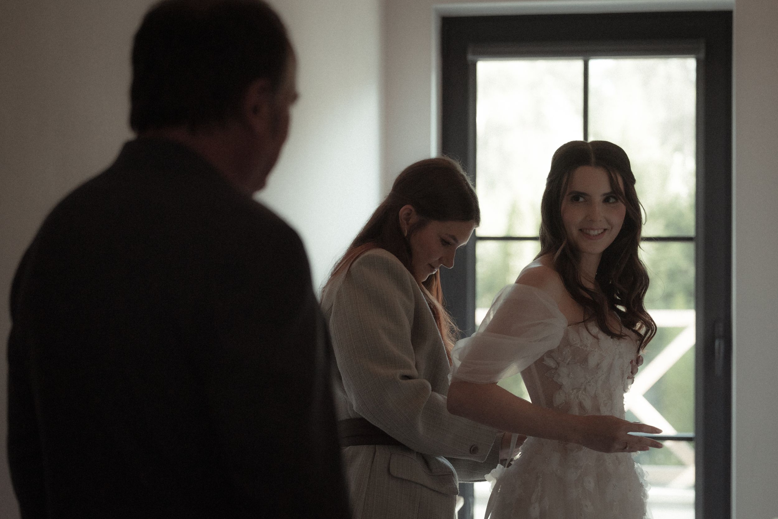 Medical professionals in white coats examine documents and collaborate in a bright office setting.