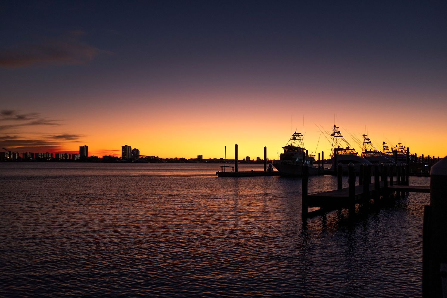 Sun melting horizon of yachts and boats