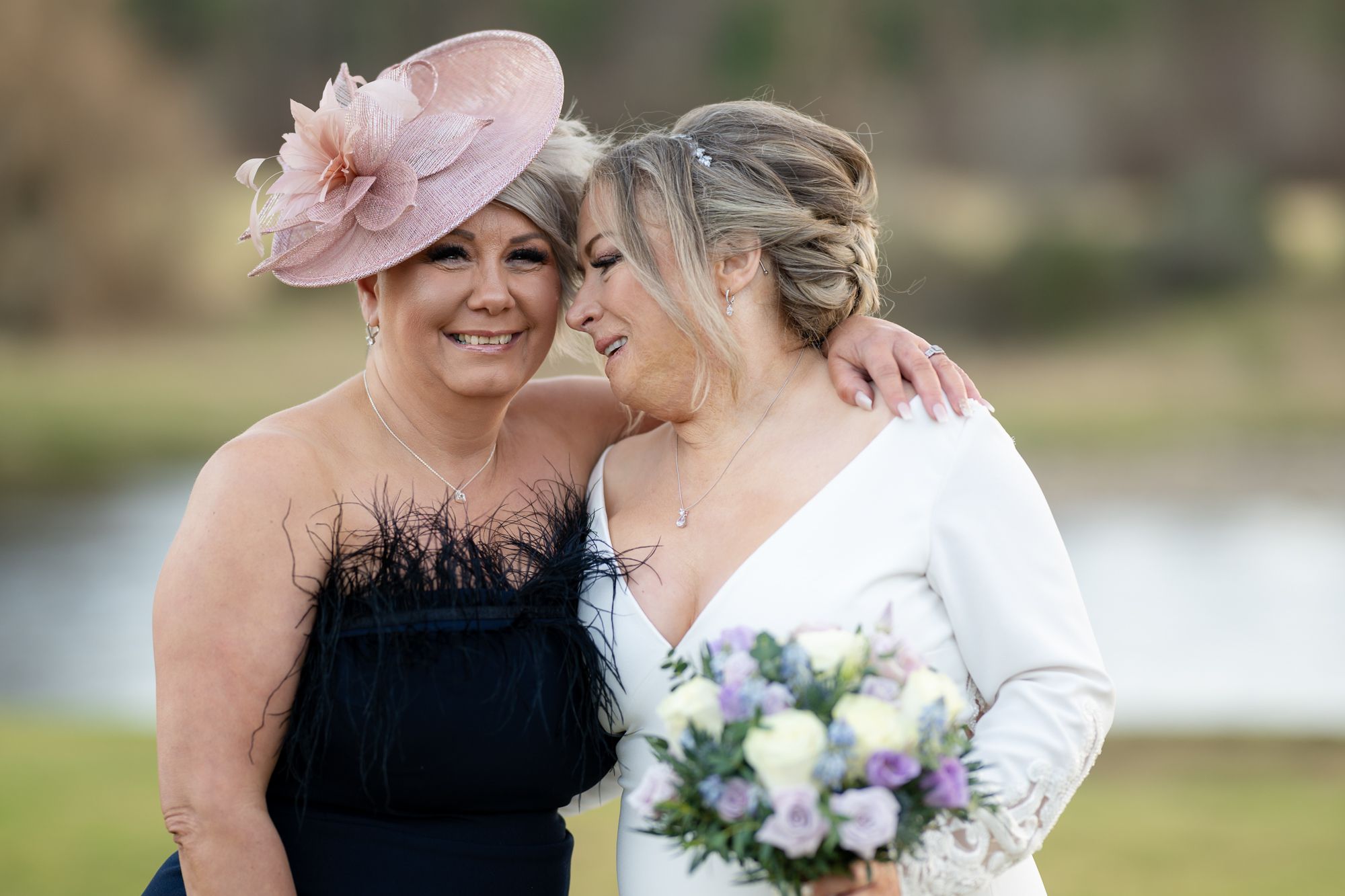 bride and friend enjoy a laugh together