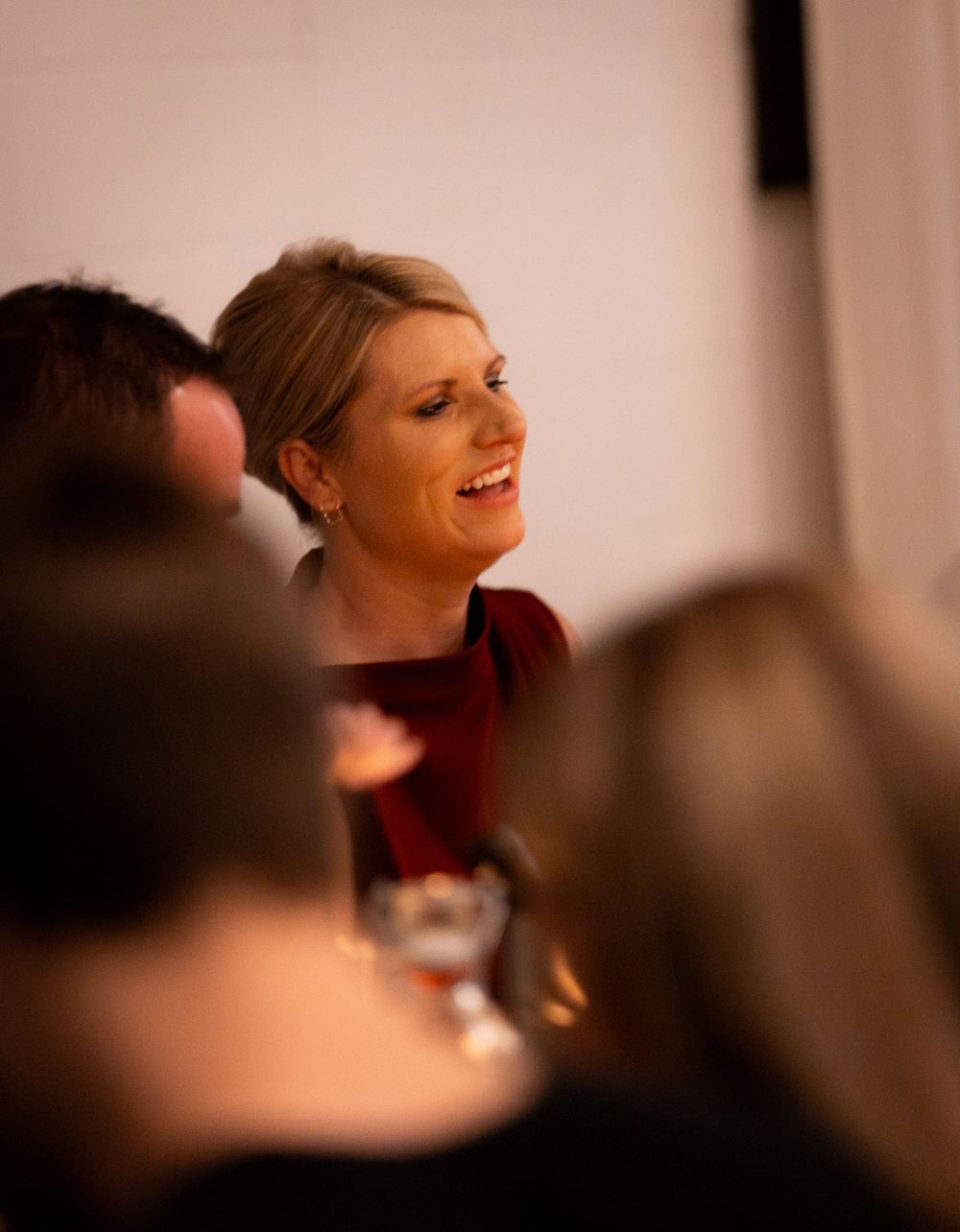 Candid moment captured during an evening event showing joyful expressions.