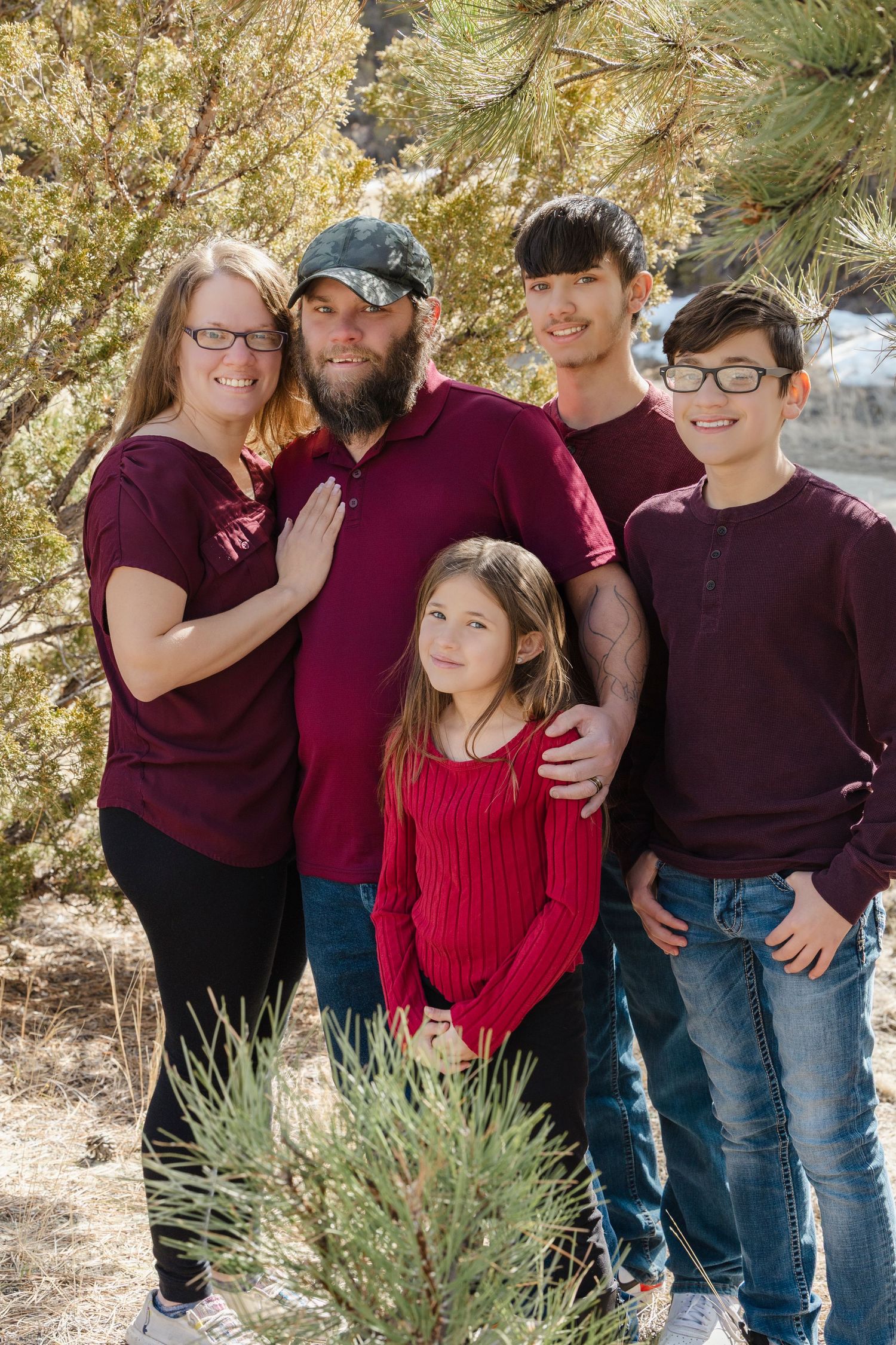 The Cox family shares smiles and sweet moments during a joyful photo session, capturing love, laughter, and togetherness.