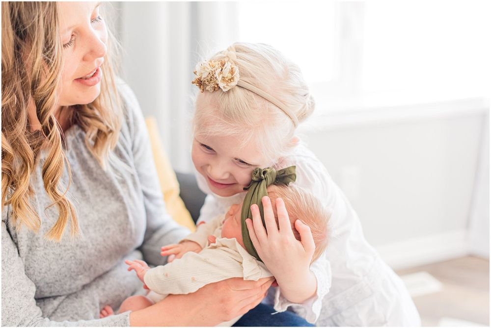 A joyful family moment captured in soft, natural window light.