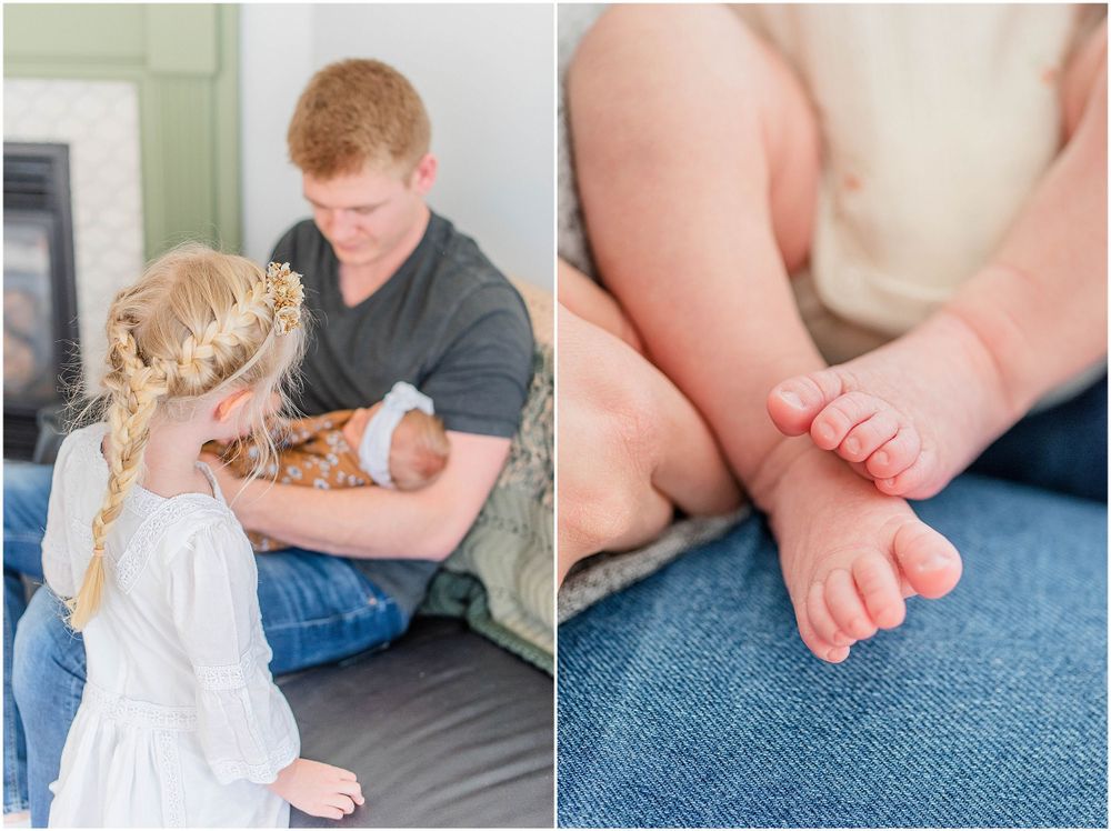 Family members sitting together on a couch looking at tiny infant feet during a lifestyle photo session.
