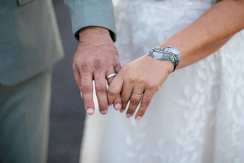 Close-up shots of wedding rings and hands showing jewelry details.