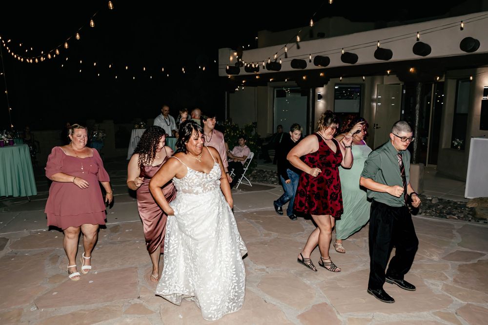 Wedding reception dance floor with guests enjoying the celebration.