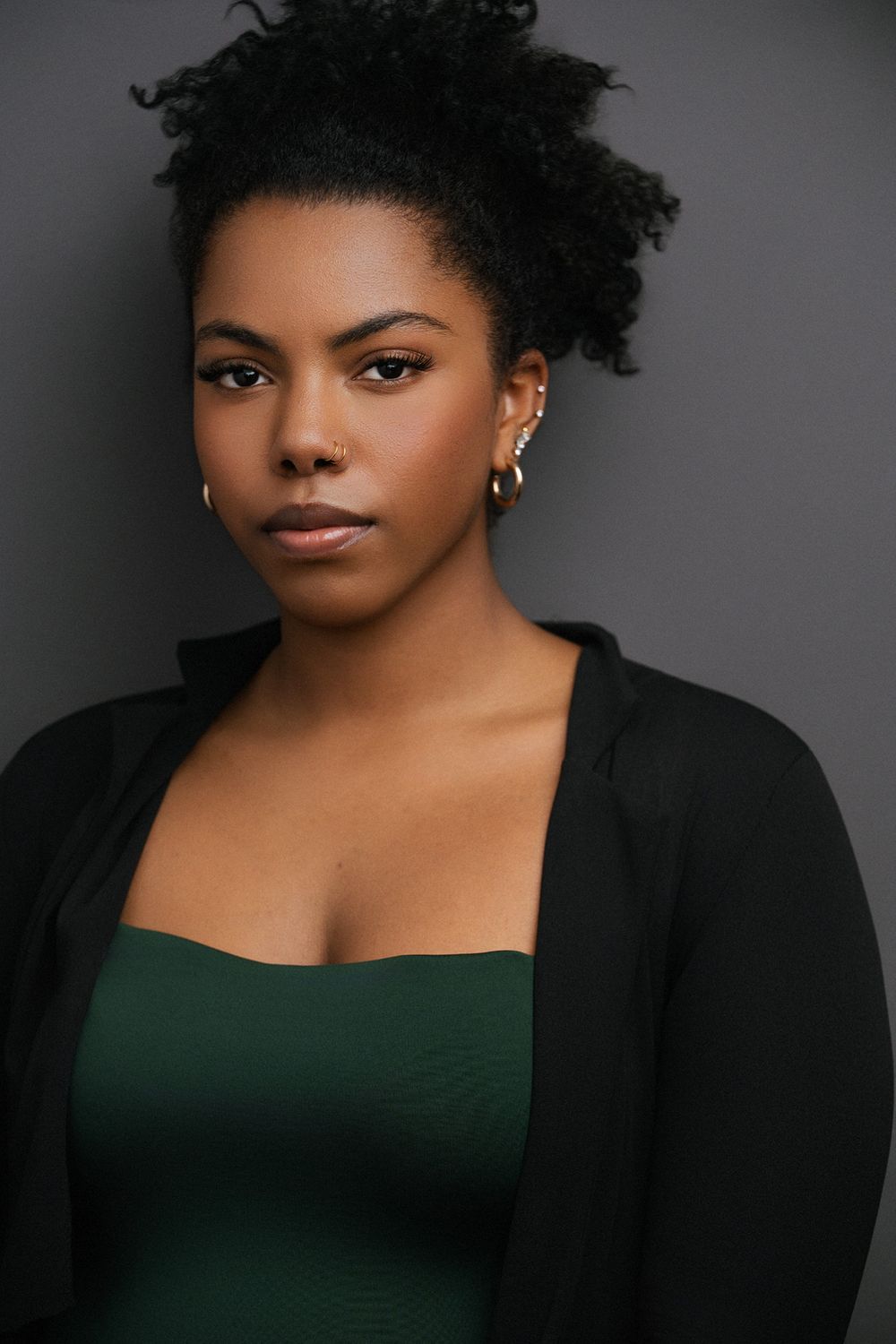 Professional headshot of a Black female actor captured in studio for film, television, and theater casting.