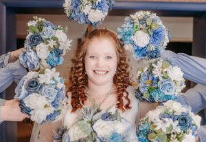 Beautiful blue and white floral bouquets arranged for winter wedding.