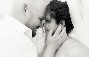 A tender intimate moment captured in black and white during a wedding portrait session.
