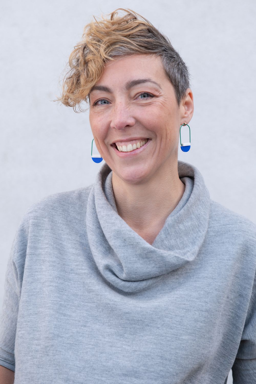 Series of casual portrait shots showing someone in a grey turtleneck sweater.