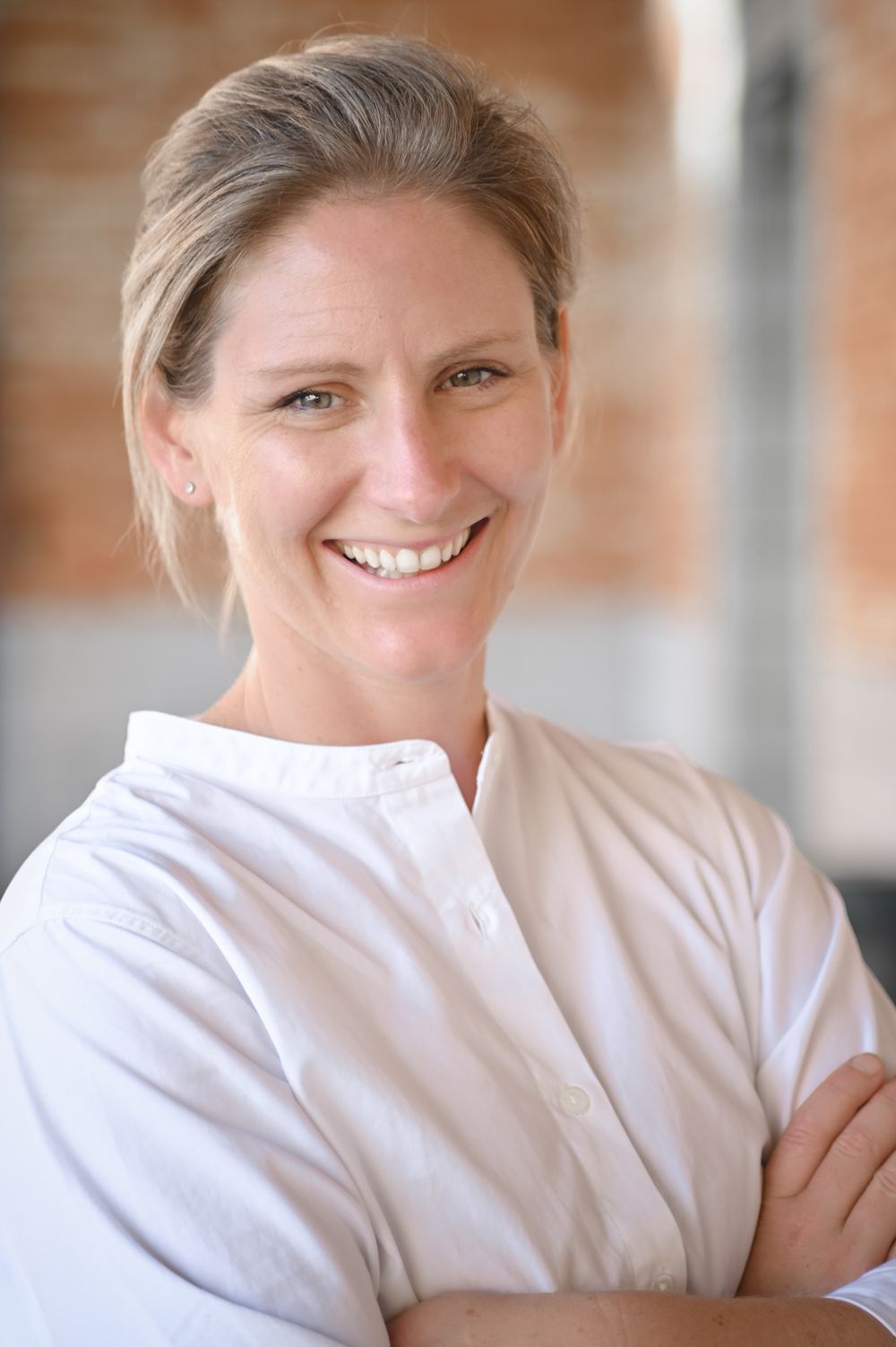 Professional headshot series showing someone in crisp white button-down shirt.