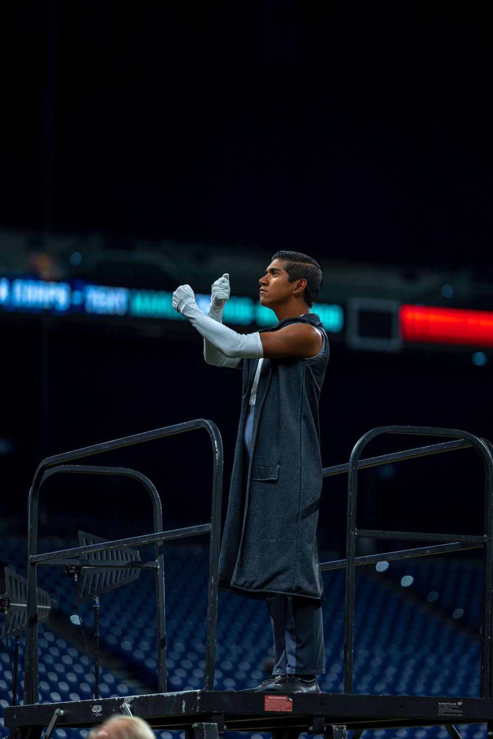 Crossmen Drum Major saluting before their performance at the Drum Corps International Show in Indianapolis