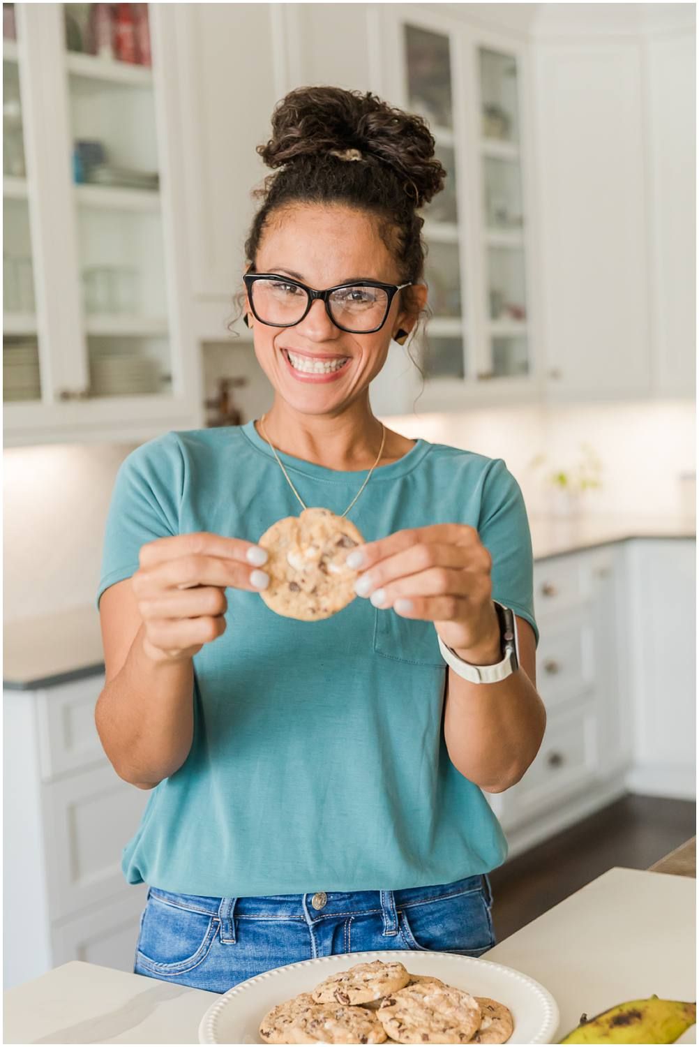 Woman holding chocolate chip cookie
