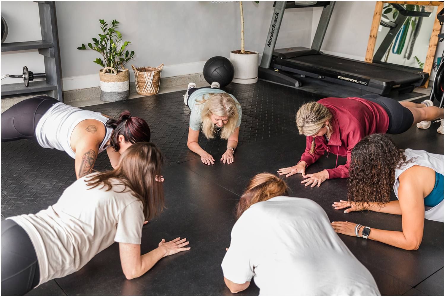 Group of females planking in circle