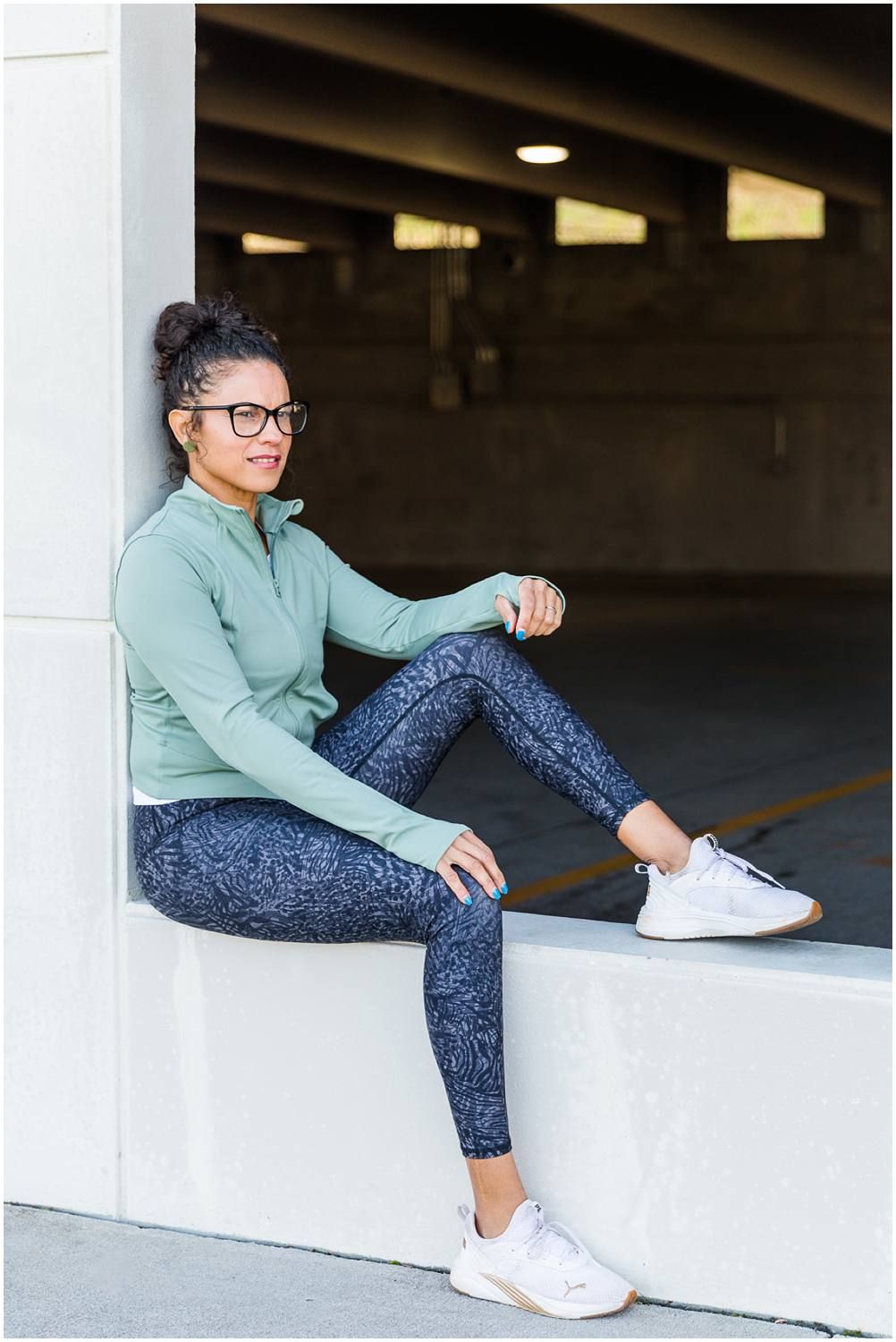 Woman sitting in parking garage window
