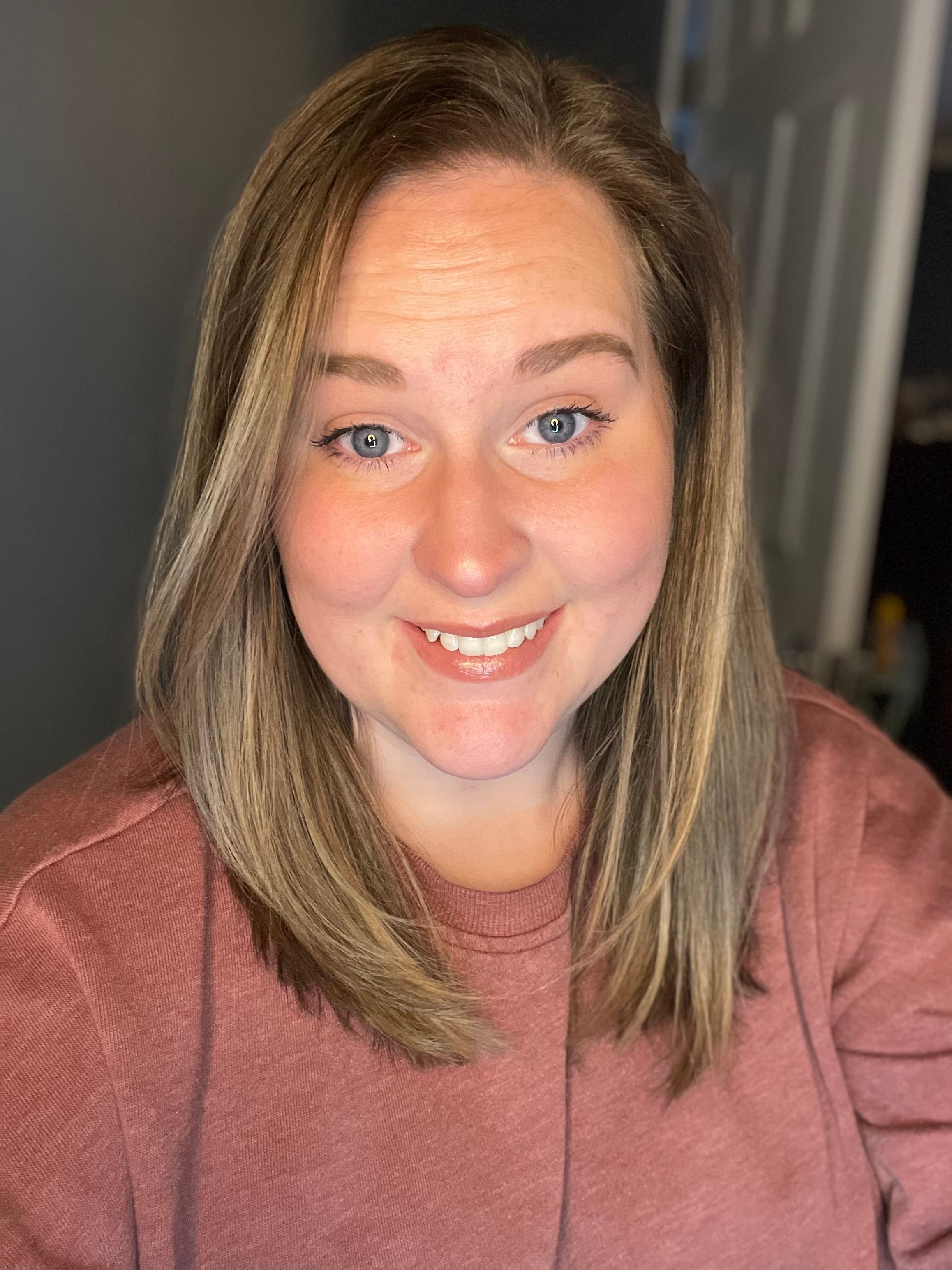 woman looking at the camera smiling for a photo