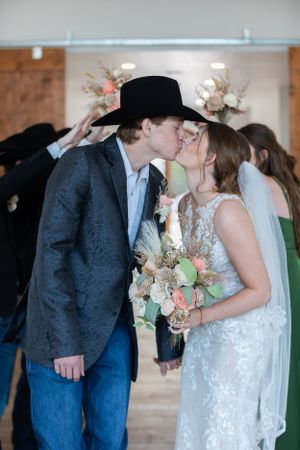 A tender moment shared between the newlyweds during their indoor reception.