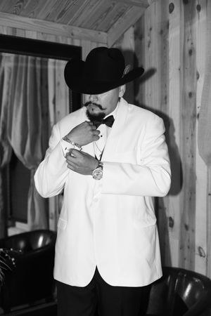 A series of black and white photos showing couples in formal attire embracing in an intimate moment.