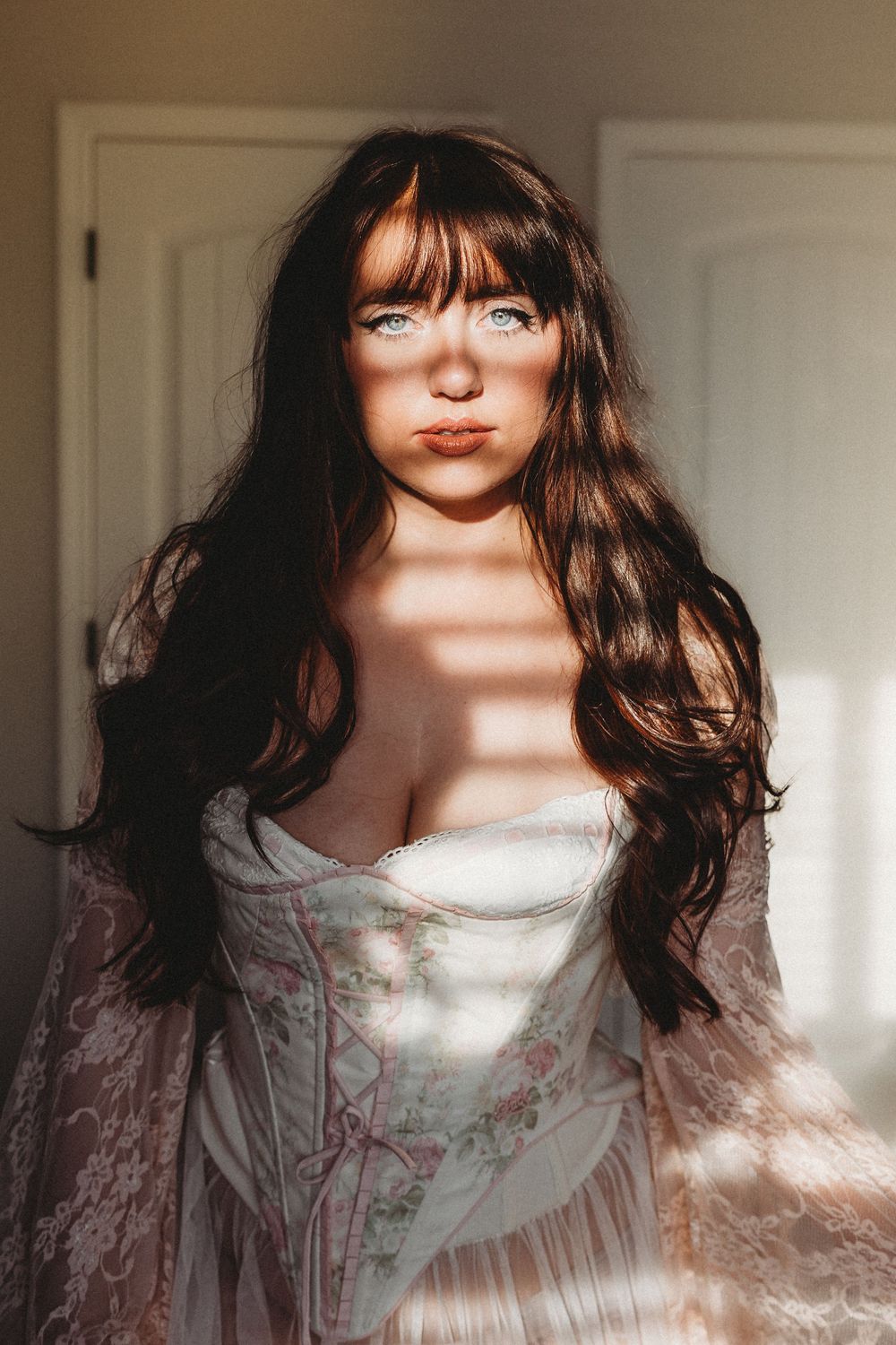 A series of soft, ethereal portraits showing a white lace dress in warm sunlight with dreamy lighting effects.