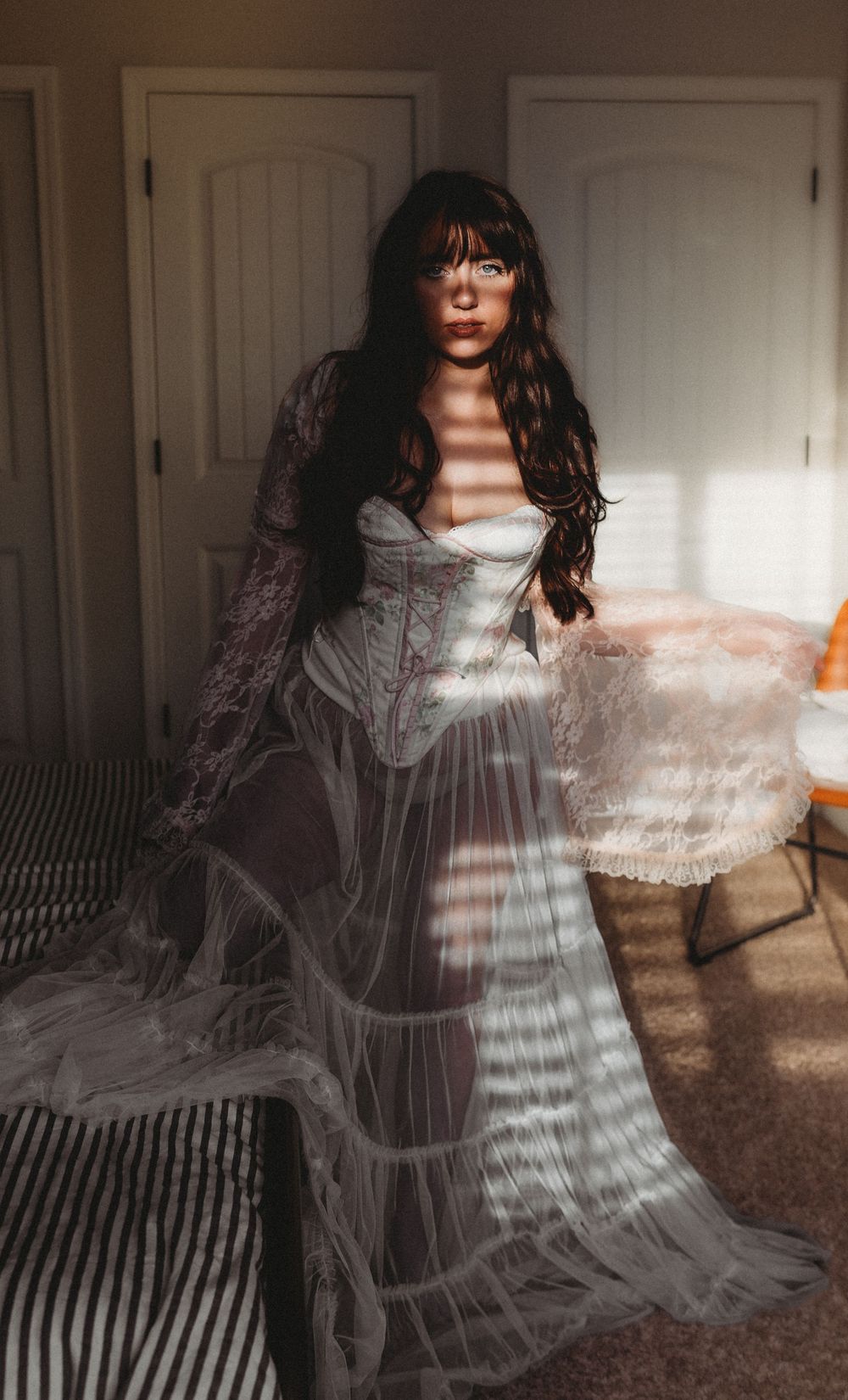 A series of ethereal portraits showing a figure in a flowing white dress creating dreamy motion blur effects.