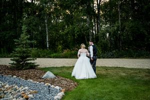 Scenic wedding venue grounds featuring stone pathways and natural landscaping.