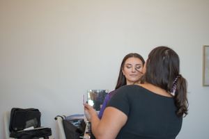 Behind the scenes view of wedding day preparations in a minimalist room setting.