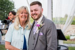 Wedding guests share joyful moments during an outdoor celebration.