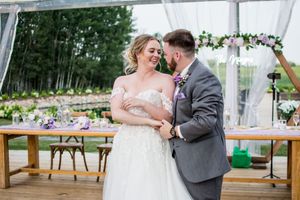 Dancing and celebration moments captured during a tented wedding reception.