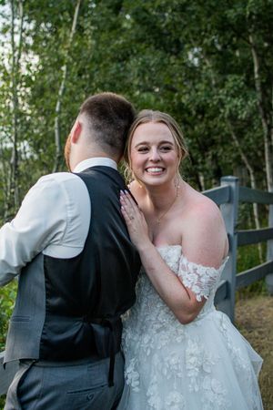 A joyful wedding moment captured in a series of candid shots against a natural woodland backdrop.