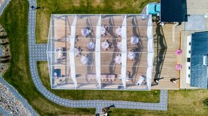 Aerial drone view of a wedding venue and surrounding landscape.
