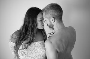 Black and white intimate portraits capturing tender moments between couple.