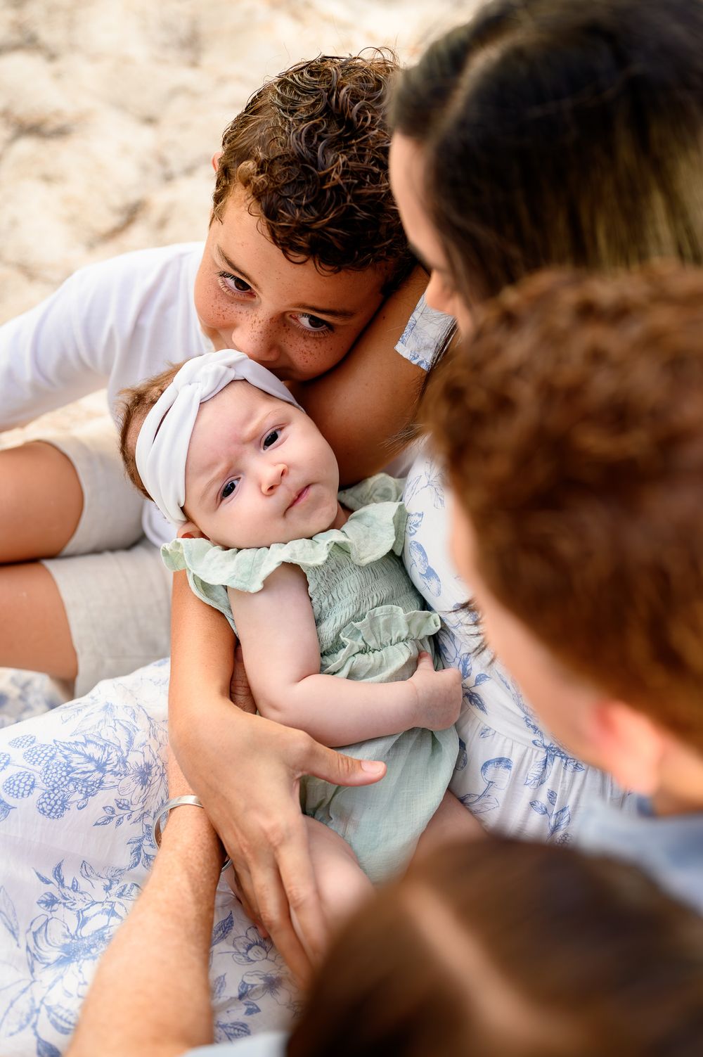 Family of five on the beach in Barbados at golden hour
