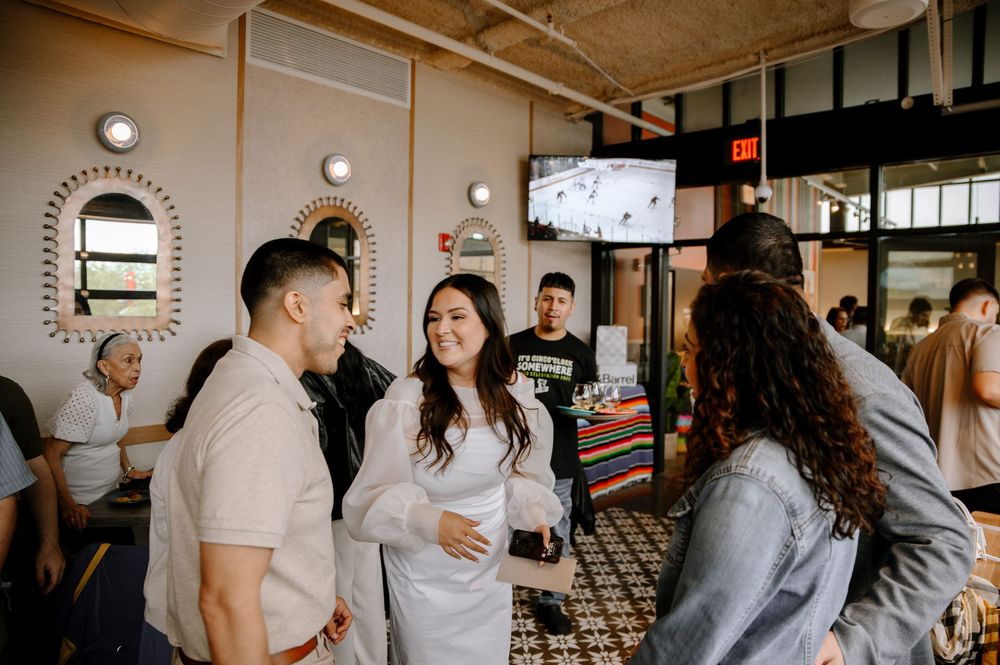 A series of candid moments captured in a rustic industrial venue with exposed brick walls and warm lighting.