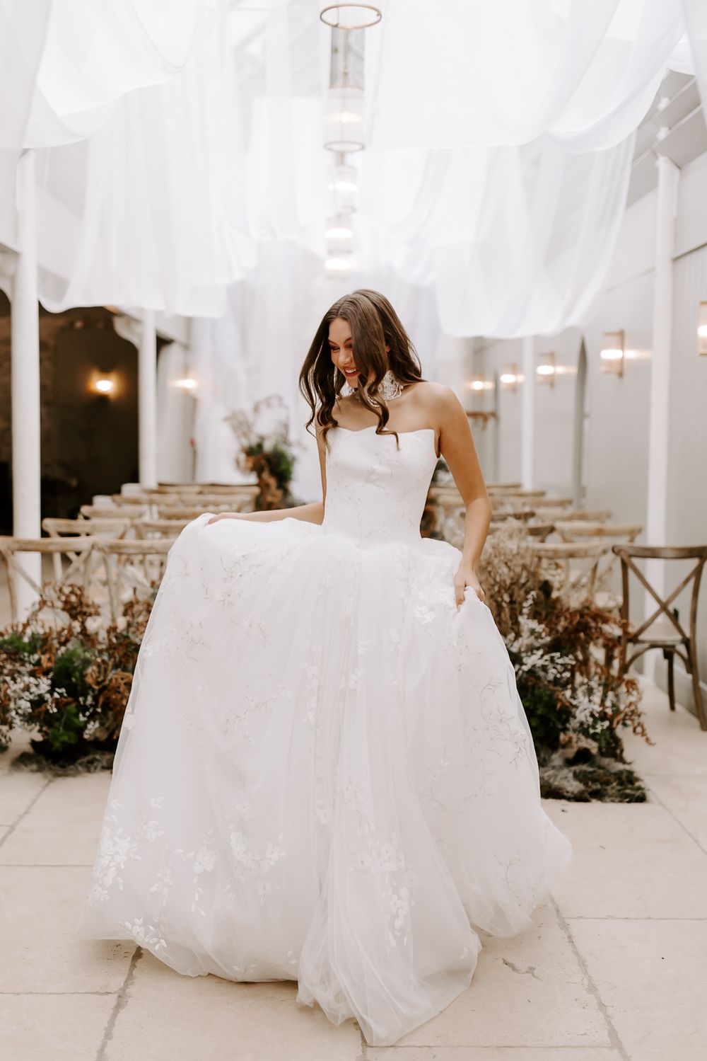 A series of four ethereal wedding photos showing flowing white gowns and delicate tulle veils in an elegant venue.