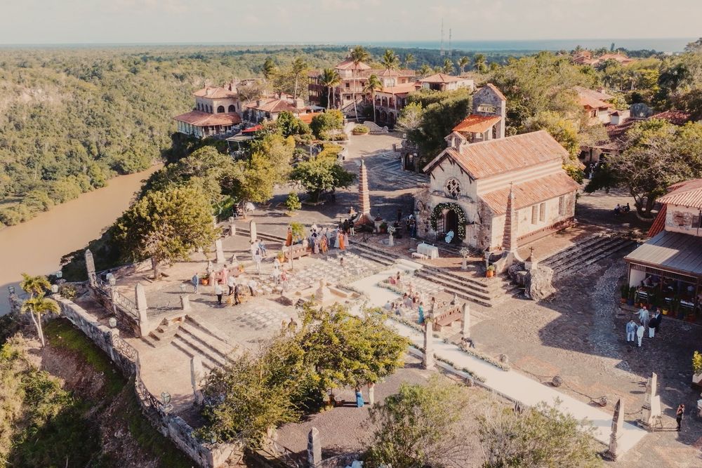 Aerial view of a Mediterranean-style venue with stone steps and terracotta roofs.