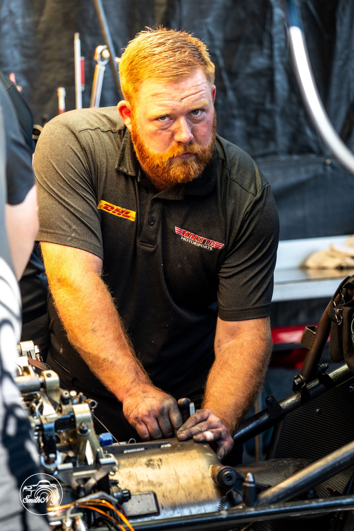 "Trackside moments captured in motion—authentic race day photography with pit lane energy and raw motorsport emotion."