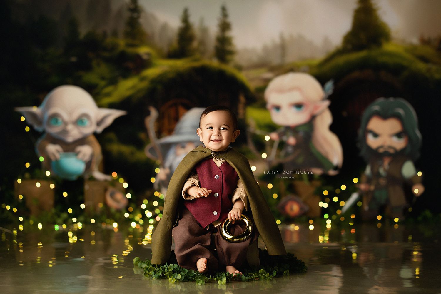 Lord of the Rings first birthday photoshoot with magical glowing lights and forest background.